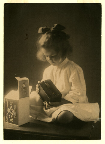 Portrait of Anna Bradford Hayden seated with Brownie camera — circa 1912