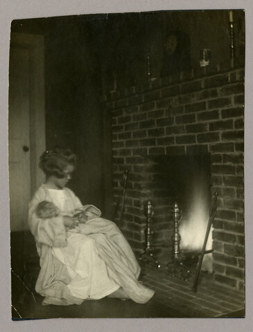 Portrait of Anna Bradford Hayden with doll before a fire — circa 1912