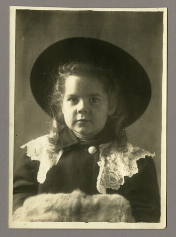 Portrait of Anna Bradford Hayden in a coat, hat, and muff — circa 1910