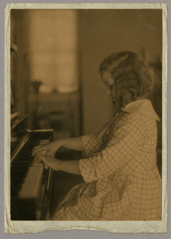 Portrait of Anna ‘Nan’ Bradford Hayden (Agle) playing piano — circa 1905-1922