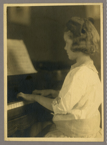 Anna ‘Nan’ Bradford Hayden (Agle) playing the piano — circa 1905-1922