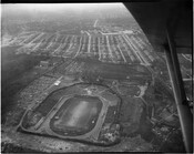 Aerial photograph of Hughes Stadium, home to the Morgan State College Bears (now Morgan State University). Named after William Hughes, Sr. (1877-1940), an 1897 alumnus of MSC who introduced football to the university by organizing a team that played in a nearby vacant lot.