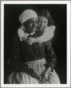 Portrait of Eliza Benson (1836-1921) being embraced by Ruth Hayden, daughter of Baltimore, Maryland, photographer Emily Spencer Hayden. With the deaths of Emily's parents A. C. Bradford "Braddie" Harrison Spencer (1841–1882) and Edward Spencer (1834–1883) in the early 1880s, care of the younger Spencer children was left to Benson. A formerly enslaved African American, Benson…