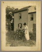 Full body portrait of a woman in a flower garden. The woman has not been identified by the photographer, Emily Spencer Hayden of Baltimore, Maryland.