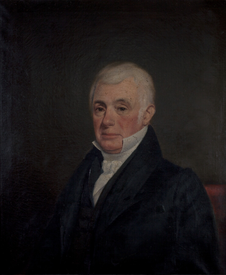Bust-length portrait of Dr. James Steuart (1755-1846) by an unattributed American painter. Steuart is pictured as a gray-haired man wearing a black coat and a white shirt with stand-up collar.