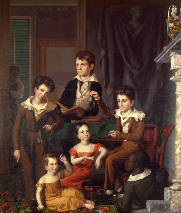 This group portrait shows the five children of Commodore John Daniel Danels (1782-1855). At left, a boy stands wearing brown skeleton suit. John Danels is seen in center wearing green jacket while at right, Lewis Danels is seated, wearing a brown skeleton suit. Eugenia Danels, seen on the stool, wears a salmon dress. Two enslaved…