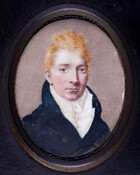 Miniature bust-length portrait of George I. Brown (1778-1820). He is portrayed with orange-blond hair, wearing a dark navy coat over a white vest and ruffled shirt. Image has tan and brown stippled background.