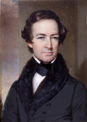 Half-length miniature portrait of George Washington Dobbin (1809-1891). He is wearing a black coat with fur collar and black stock and white shirt.