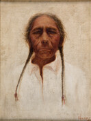 Frontal portrait of Dore Lix Arnaf or Ka-la-weh. The sitter is an older man with his gray hair tied in two braids that fall in front of his white collared shirt.