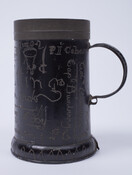 Blackened tin mug etched with the names of men who defended Baltimore in 1814. Owned by Samuel Etting, a prominent Baltimorean and a member of the Baltimore Fencibles during the War of 1812.