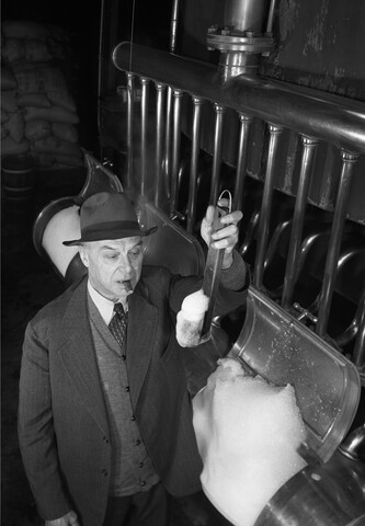 Man testing beer at National Brewing Company — 1946