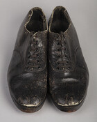 Pair of tap shoes worn by Bill Robinson, given to Paul S. Henderson by Bill Robinson(1878-1949), A.K.A. Bojangles. Robinson was potentially the most famous tap dancer of his time, most famous for his performance in the 1928 run of "Blackbirds" on Broadway. Robinson was one of the first black dancers to perform in white vaudeville…