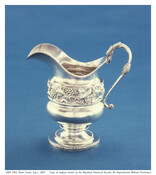 Baltimore-made creamer with leaf and grape band at center, monogrammed "RRH." A covered sugar bowl with the same monogram and pattern (1959.135.2) was included in this donation.