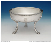 Raised silver bowl with 3 long claw feet, relief border, and applied leaf decoration on rim. Engraved with the Bonaparte coat of arms and monogrammed with the initials "PRB."