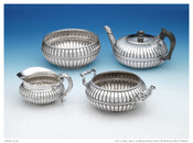 Silver tea service including teapot, sugar and waste bowls, and creamer belonging to Elizabeth Patterson Bonaparte (1785-1879). All pieces in the set are low and rounded with scalloped sides decorated with a smaller scalloped band and embellished handles.