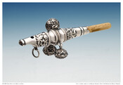 Ornate silver rattle with bells and ivory whistle. Belonged to Ellen Channing Day (Mrs. Charles J. Bonaparte).