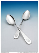 Pair of silver serving spoons with pointed bowls, Bonaparte family crest of crowned shield on handles, and ball rest on backs.