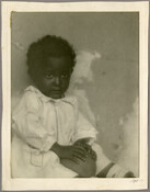 Portrait of a young child "Brown Betty" holding a ball. The child's relationship to the Baltimore, Maryland, photographer Emily Spencer Hayden is unknown.