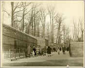 Visitors viewing the animals in enclosures at the Baltimore Zoo (now the Maryland Zoo in Batimore) located in Druid Hill Park in northwest Baltimore City, Maryland. The zoo, one of the oldest in the United States, opened in 1876.