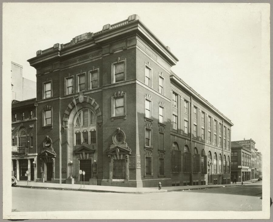 The National Marine Bank located at 33 South Gay Street, Baltimore, Maryland, as seen from the northeast corner of Water Street. "Headley Chocolate Company" can be seen painted on the side of a building on Water Street.