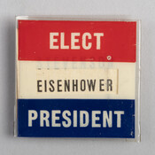 Campaign Button from the presidential election of either 1952 or 1956. A piece of paper with the name of either presidential candidate could be slid into the center window of the button to express support. This button expresses support for President Dwight D. Eisenhower