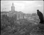 Baltimore Street between Calvert and Guilford Street in ruins after the Great Fire of 1904 in Baltimore, Maryland. The image shows City Hall and Shot Tower in the background.