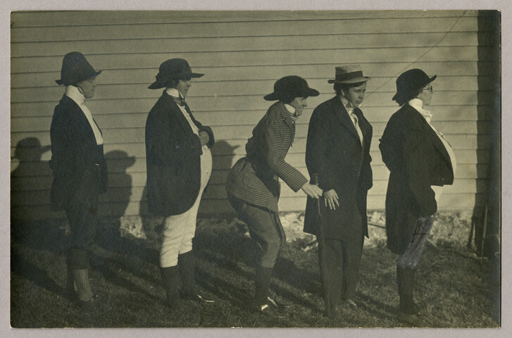 Group portrait of five women in men’s dress — undated
