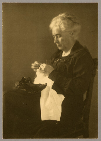 Portrait of Georgianna Swett Hayden seated with her sewing — undated