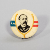 Campaign button for Alton B. Parker (1852-1926) featuring his bust-length portrait in black and white within a yellow wishbone. A blue banner with two stars appear to the left of the image, while red and white stripes appear on the right. Parker was a New York judge who ran for president as a Democrat in…