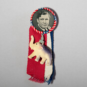 Campaign button and ribbon with plastic elephant. The button features a picture of Lewis Wendell Wilkie (1892-1944) who was a candidate in the presidential election of 1940. The elephant represents the symbol of the Republican Party. Wilkie was defeated by incumbent democrat President Franklin Delano Roosevelt (1882-1945).