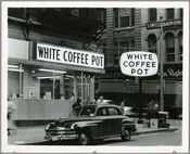 View of the White Coffee Pot restaurant, once located at Howard and Baltimore Streets in Baltimore, Maryland. Verso transcription: Cronhardt & Sons Photographers, Baltimore, MD