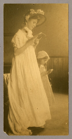 Woman and child reading — undated