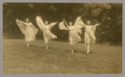 Women from Goucher College dancing in costume. From a series of photographs by the Baltimore, Maryland, photographer Emily Spencer Hayden featuring students from Goucher College performing “Cupid and Psyche.” A note on back of one of the photographs states that the women’s performance stopped traffic on Edmondson Avenue. The students were likely part of a…