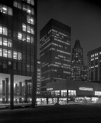 Night shot of Hamburgers clothing store at Charles Center in Baltimore, Maryland. In 1997, the 1963 Hamburgers Building, situated on a bridge above Fayette Street next to One Charles Center, was demolished.